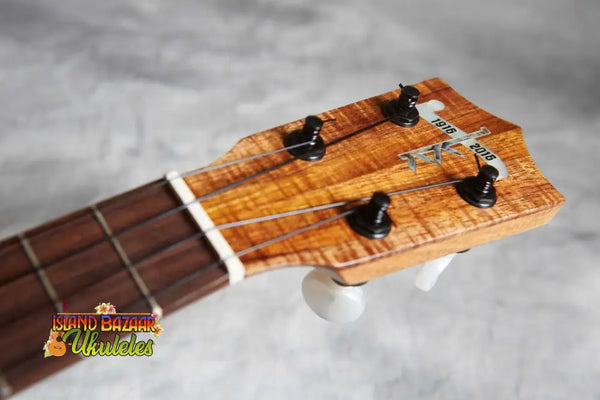 Ukulele headstock showcasing Curly Koa wood and black tuning pegs, Kamaka HP-1 Pineapple