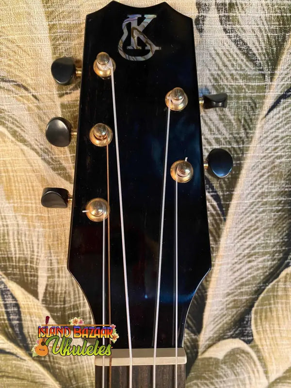 Guitar headstock with KC logo and tuning pegs on Kanile’a 5-String Super-Concert Ukulele KPA-C-SC