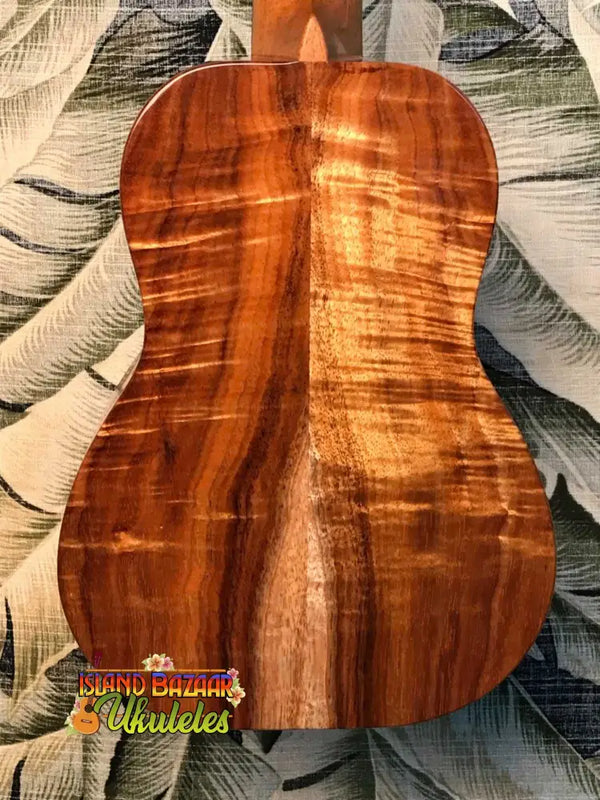 Beautiful back of Kanile’a Concert Ukulele in Curly Hawaiian Premium Koa wood