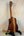 Wooden Kanile’a Concert Ukulele with curly koa wood grain and deluxe gig bag