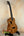 Brown Kanileʻa D-1 tenor ukulele with heart-shaped sound hole and solid Hawaiian koa