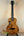 Brown patterned ukulele made of solid Hawaiian koa with deluxe gig bag and Kanileʻa D-1 design