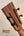 Wooden guitar headstock with black tuning pegs on Kanile’a DK-T D-Hole Tenor Ukulele