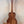 Wooden Kanile’a DK-T D-Hole Tenor Ukulele showcasing premium Koa’s curly grain patterns