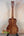 Wooden Kanile’a DK-T D-Hole Tenor Ukulele showcasing premium Koa’s curly grain patterns