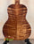 Acoustic guitar featuring striking figured wood grain on Kanile’a DK-T D-Hole Tenor Ukulele