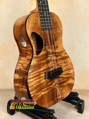 Brown wooden Ukulele from Kanile’a DK-T Pro Tenor Ukulele with premium koa build