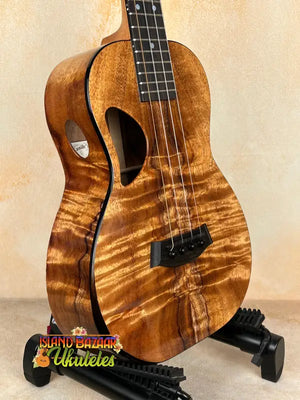 Brown wooden Ukulele from Kanile’a DK-T Pro Tenor Ukulele with premium koa build