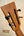 Ukulele headstock with black tuning pegs on Kanile’a DK-T Pro D-hole Tenor Ukulele with premium koa