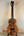 Brown wooden Kanile’a DK-T Pro Tenor Ukulele with d-hole design and sound port