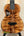 Brown wooden Kanile’a DK-T Pro Tenor Ukulele with D-hole design and premium koa finish