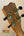 Guitar headstock with gold tuning pegs and black knobs on Kanile’a Hawaiian Islands Ukulele