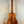 Wooden acoustic guitar showcasing Kanile’a Hawaiian Premium Tenor Ukulele Curly Koa design