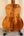 Acoustic guitar featuring the Kanile’a Hawaiian Premium Tenor Ukulele Curly Koa back panel