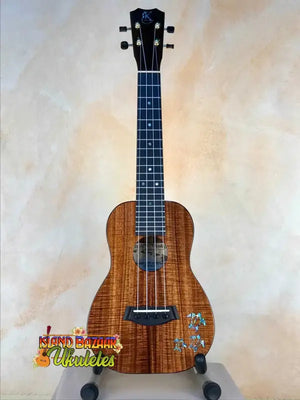 Wooden Kanile’a HNS-T-PREM Concert Ukulele with floral inlays and padded gig bag