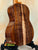 Kanile’a HNS-T-PREM Tenor Ukulele showcasing premium curly koa wood grain pattern