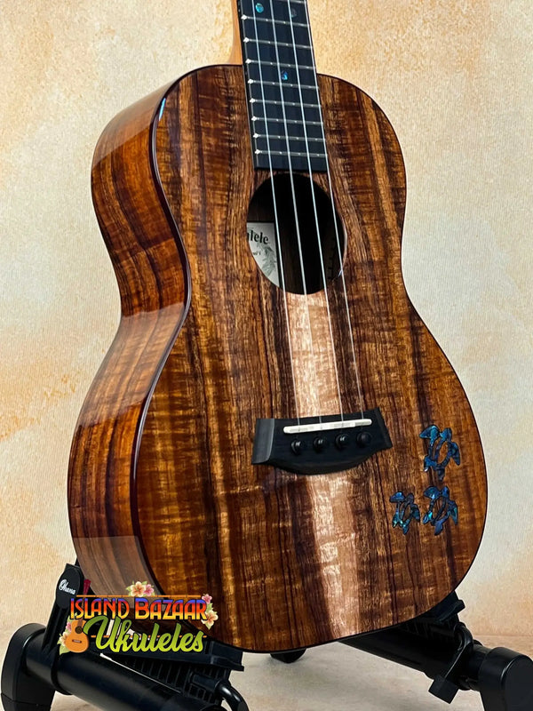 Beautiful Kanile’a HNS-T-PREM Tenor Ukulele in premium curly koa with blue floral inlay