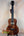 Beautiful Koa wood Kanile’a Honus Tenor Ukulele with decorative inlays and dark grain patterns