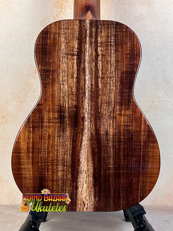 Acoustic Kanile’a Honus Tenor Ukulele with striking striped koa wood back display