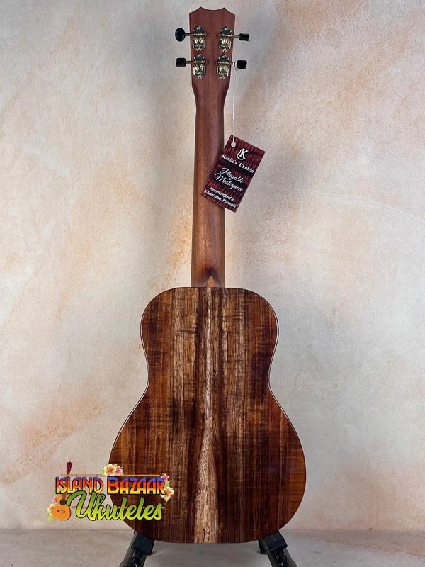 Acoustic guitar with striped wood grain, featured in Kanile’a Honus Tenor Ukulele