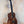 Wooden Kanile’a Honus Tenor Ukulele featuring dark grain and black tuning pegs