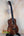 Wooden Kanile’a Honus Tenor Ukulele featuring dark grain and black tuning pegs
