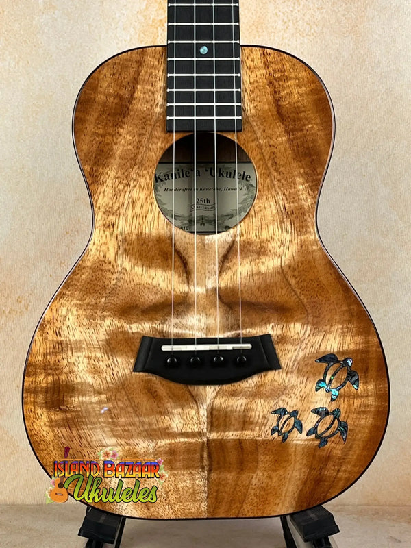 Beautiful Kanileʻa Honus Tenor Ukulele with dolphin design and koa wood finish