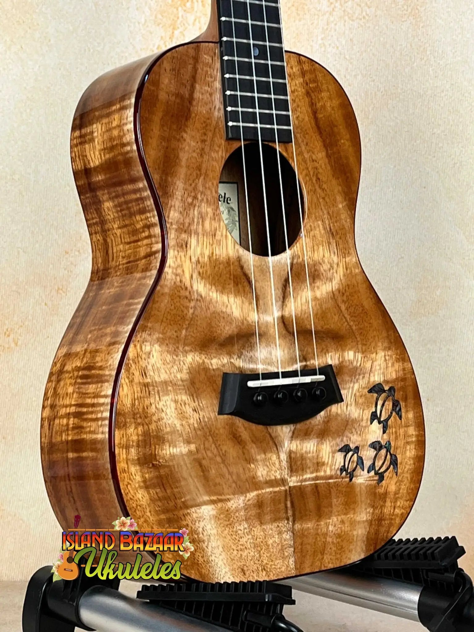 Beautiful Koa wood Kanileʻa Honus Tenor Ukulele with glossy finish and black bridge