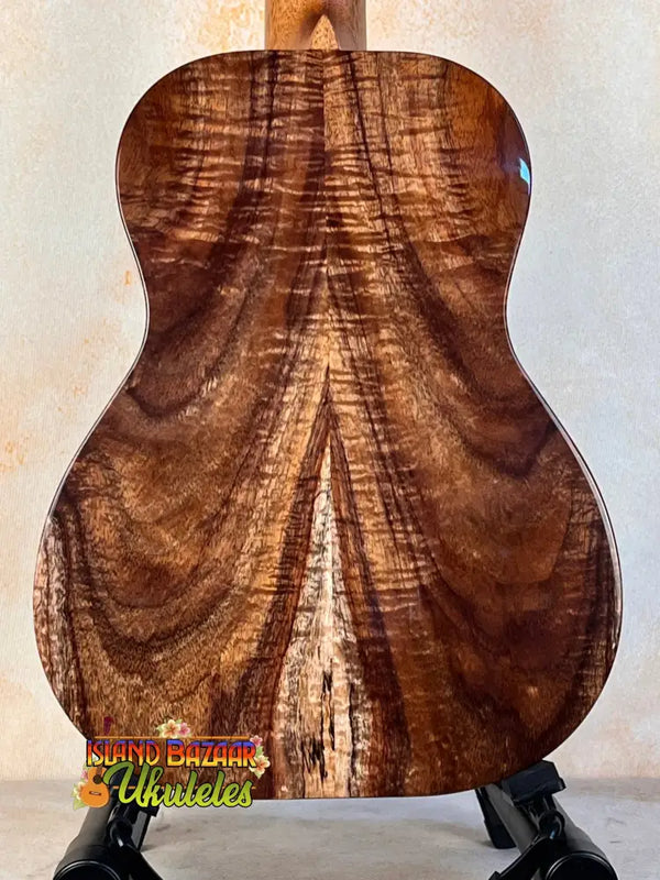 Acoustic guitar featuring figured walnut back on Kanile’a ISL-T Hawaiian Islands Tenor Ukulele