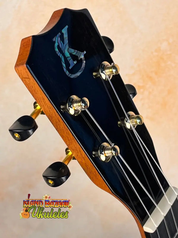 Guitar headstock with gold tuning pegs on Kanile’a ISL-T Hawaiian Islands Tenor Ukulele