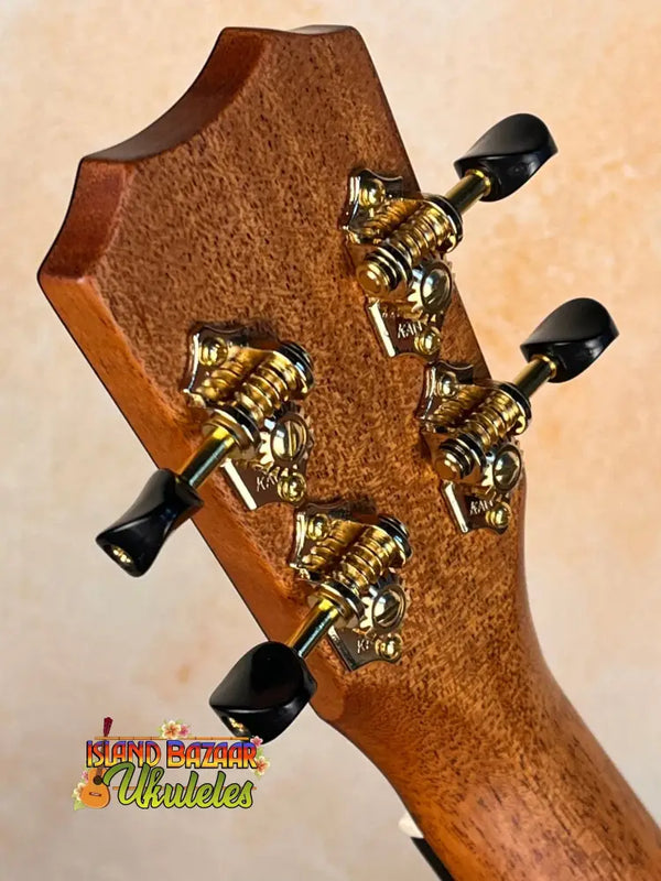 Guitar headstock with gold tuning machines on Kanile’a ISL-T Hawaiian Islands Tenor Ukulele