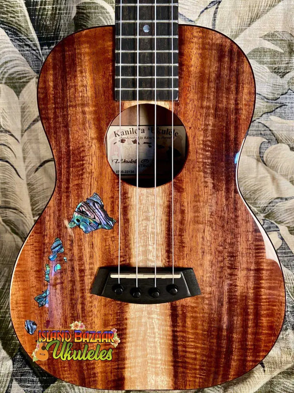 Beautiful Koa wood Kanile’a ISL-T Tenor Ukulele with blue butterfly inlay decorations