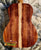 Acoustic guitar featuring beautiful grain of Koa wood, part of Kanile’a ISL-T Tenor