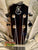 Guitar headstock with KC logo and tuning pegs on Kanile’a ISL-T Tenor Ukulele