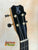 Black guitar headstock with silver tuning pegs from Kanile’a K-1 Deluxe at Island Bazaar