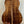 Acoustic guitar showcasing figured Koa wood back of Kanile’a K-1 Deluxe Tenor Ukulele