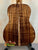 Acoustic guitar showcasing figured Koa wood back of Kanile’a K-1 Deluxe Tenor Ukulele