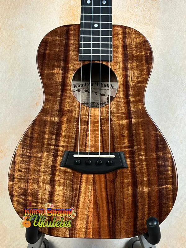 Kanile’a K-1 Deluxe Tenor Ukulele showcasing beautiful koa wood with striking grain patterns