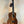 Beautiful Koa wood Kanile’a K-1 Deluxe Tenor Ukulele displayed on a stand