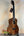 Beautiful Koa wood Kanile’a K-1 Deluxe Tenor Ukulele displayed on a stand