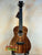 Beautiful koa wood Kanile’a K-1 Deluxe Tenor Ukulele with dark grain patterns