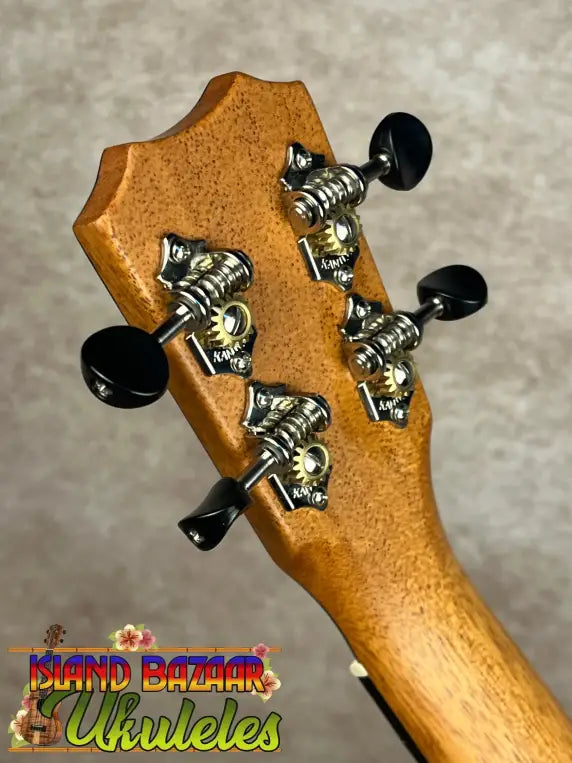 Back of Kanileʻa K-1 Soprano ukulele headstock with tuning pegs in premium Hawaiian koa