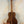 Acoustic guitar crafted from rich brown Koa wood, featured in Kanile’a K-1 Tenor Ukulele