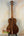 Acoustic guitar crafted from rich brown Koa wood, featured in Kanile’a K-1 Tenor Ukulele