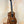 Wooden Kanile’a K-1 Tenor Ukulele in deluxe koa wood on a black stand at Island Bazaar