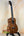 Wooden Kanile’a K-1 Tenor Ukulele in deluxe koa wood on a black stand at Island Bazaar