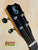 Guitar headstock with chrome tuning pegs and blue logo on Kanile’a K-1 Tenor Ukulele