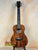 Beautiful kanile’a K-1 tenor ukulele in deluxe koa wood showcasing dark grain patterns