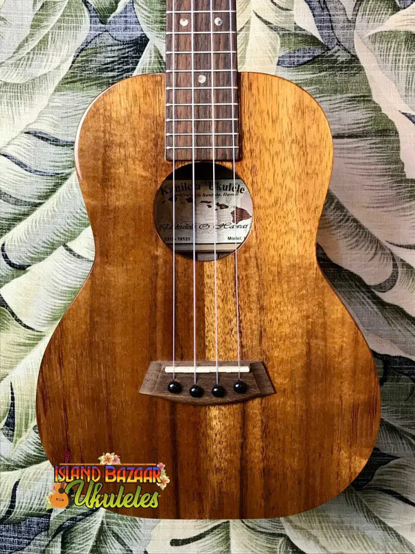 Wooden ukulele featuring Hawaiian Koa wood, part of the Kanile’a K-1 Tenor at Island Bazaar