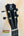 Black ukulele headstock with silver tuning pegs and Kanile’a K-1 Tenor logo